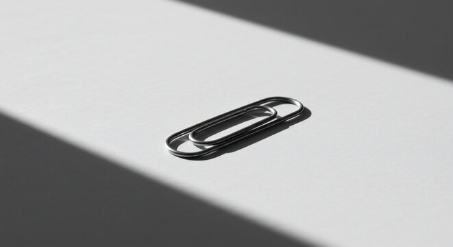 Metal cotter pin on gray background