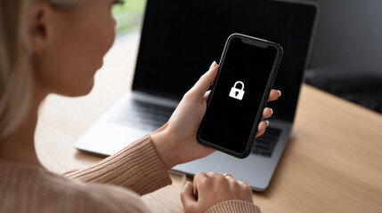 Woman holding smartphone with padlock icon, symbolizing mobile security, data protection, and digital privacy