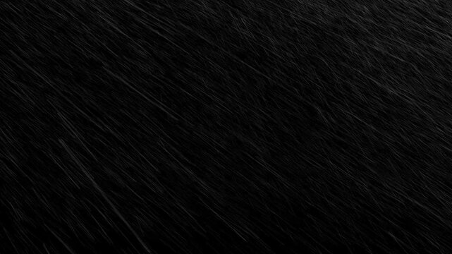 Very fast rain storm falling diagonally against black background. Intense weather overlay for action or dramatic scenes
