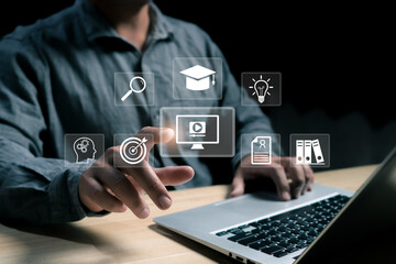 Modern digital learning concept with a person using a laptop and virtual icons for education, research, video, innovation, and knowledge management in an online technology environment.