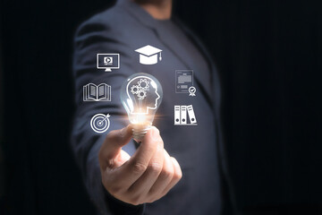 Education and learning concept. man holding glowing light bulb surrounded by icons knowledge, online courses, books, graduation, certification, and skill development, highlighting modern education.