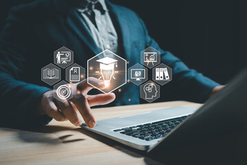 Business professional using a laptop with virtual education and innovation icons, representing digital learning, online training, knowledge management, and modern technology for corporate growth.