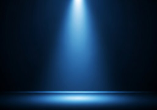 A bright blue spotlight illuminates a dark stage background for a dramatic effect