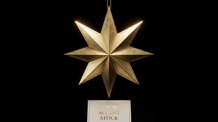 Shiny luxurious golden eight pointed christmas star ornament hanging against isolated dark background