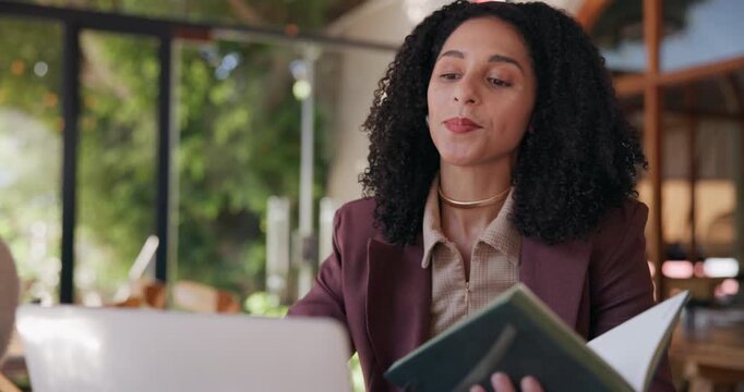 Business woman, laptop and video call with book in cafe for online meeting, discussion or chat. Female person, remote work or virtual webinar with computer or notebook for communication or advice