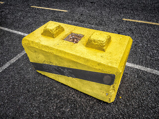 Yellow concrete block in Middle of Parking Lot © Luc V. de Zeeuw