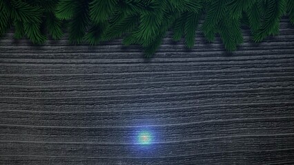 Hanging evergreen pine branches are draping across wood under teal light in flat-lay, holiday decor © vectorfusionart