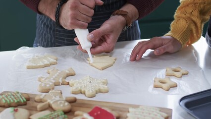 parent is decorating tree-shaped sugar cookie in flat design style, food theme featuring piping bag © vectorfusionart