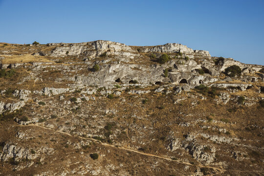 Trail and hill with sassi dwellings of Matera Italy