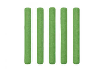 Five green grass cylinders standing vertically