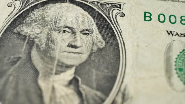 One dollar bill from 1963 featuring George Washington. Focuses on detailed design. State backed currency used in daily financial exchanges. Legal tender for settling national and private debt