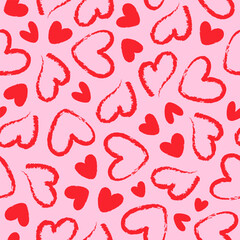Seamless pattern of red hand drawn romantic hearts on a pink background. Design elements for Valentine's Day. Vector illustration