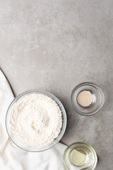 Overhead view of ingredients for making scallion pancake dough, process of making scallion pancakes