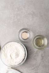 Overhead view of ingredients for making scallion pancake dough, process of making scallion pancakes