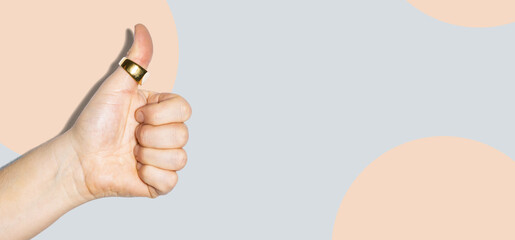 Thumbs up gesture on mint background banner