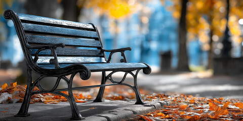 Black cast iron bench sits in park surrounded by vibrant autumn leaves, creating serene and picturesque scene. blurred background highlights bench elegant design