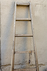 Old ladder leaning against the wall