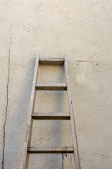 Old ladder leaning against the wall