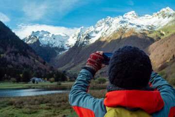 hiking photographer in the mountains around Lake Estaing, France