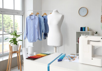 White mannequin in interior of light atelier