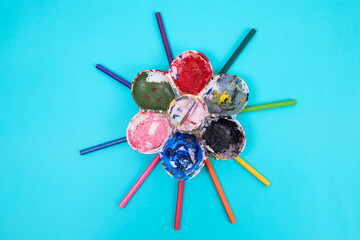 Top View of Handmade Craft Item With Paint Covered Balls and Plastic Sticks
