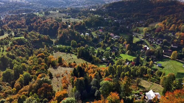 golden autumn aerial over village, cartographer mapping roads, scattered houses, orchards, meadows, patchwork