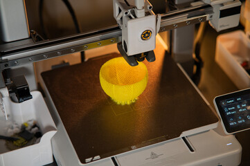 A student man print prototype on 3D printer