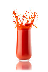 Bright red fresh tomato juice in glass with dynamic splashes, flying drops, isolated on white background. Vitamin vegetable smoothie for healthy fitness menu, diet program or wholesome cuisine, detox.