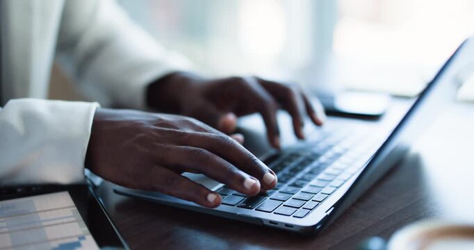 Hands, person and typing with laptop in office for research, data entry and insurance report. Broker, pc and tech for claims process application, policy renewal and customer portfolio for coverage