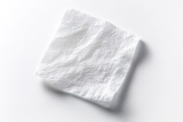 Closeup aerial image of a damp disposable wipe isolated on white
