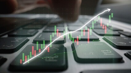 This image showcases a close-up of a keyboard with a financial graph overlay, representing stock market trends and trading activities in a digital financial environment. Copula