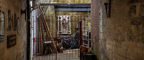Historic city centre Dutch town Valkenburg, The Netherlands, street scene shrine in patio of residential home