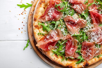 Pizza with prosciutto (parma ham), arugula (salad rocket) and parmesan on white background top view. Italian cuisine