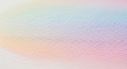 Subtle pastel gradient on paper with visible surface texture abstract