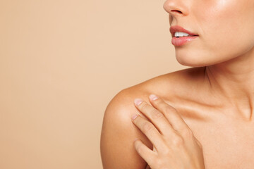 Close up cropped shot of beautiful half naked topless young woman 20s with nude make up isolated on plain beige color wall background studio portrait Skin care healthcare cosmetic procedures concept. © ViDi Studio