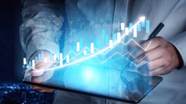 A businessman uses a digital tablet to analyze financial data with visual graphs against a modern cityscape backdrop, representing global market insights and trends. Copula - Powered by Adobe