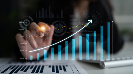 Business professional engaging with digital growth chart in a modern office, demonstrating data analysis, trends, metrics, and strategic planning for business enhancement. Scalp