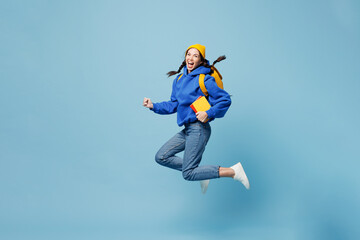 Full body fun happy smiling young smart woman student she wear casual clothes yellow hold backpack...