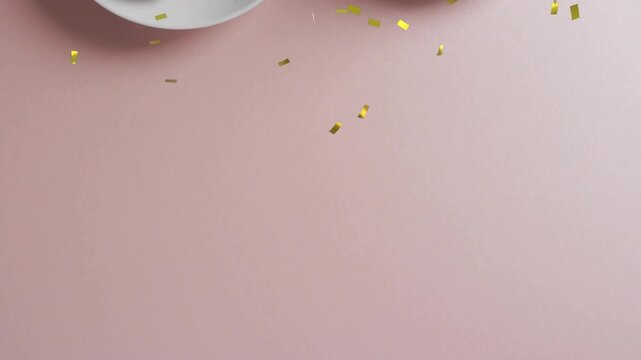 Gold confetti release sending pieces falling, revealing bitten donut and milk cup for celebration