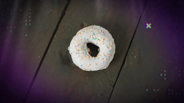 Purple cueing dots and crosses pulsing, fading around center frosted donut, evoking retro look
