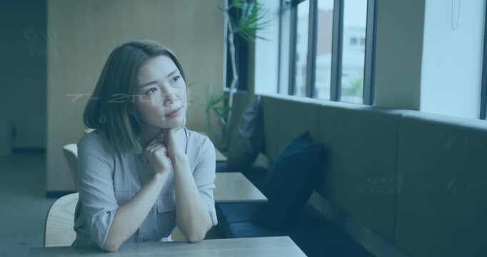Woman at cafe window opening eyes and scanning view while formulas overlaying head, aiding science