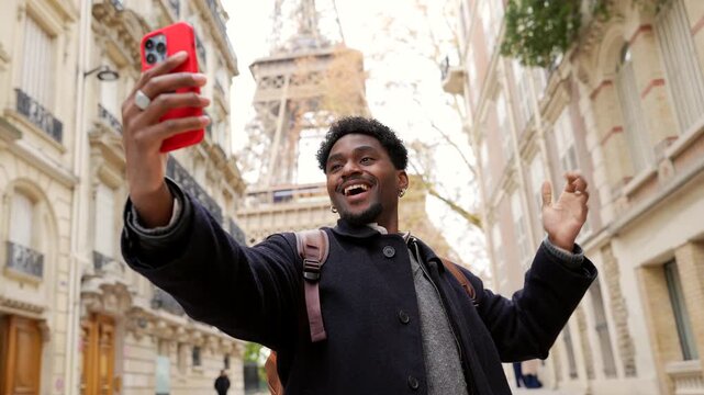 Happy african american tourist vlogging in paris with eiffel tower