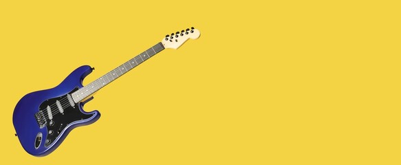 Modern electric guitar on yellow background with space for text