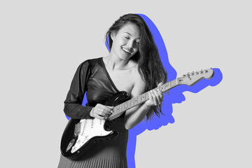 Young woman playing electric guitar on color background
