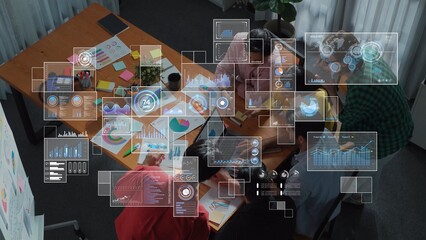 A dynamic team collaborates in a modern office, utilizing data visualization tools to enhance analytics and drive strategic business insights through focused teamwork. Raster