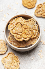 Homemade dog treats in bowl with paw prints