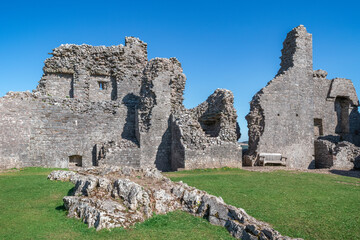 The ruin of Carreg Cennen Castle sited on a high rocky outcrop in Carmarthenshire, Wales on a sunny day