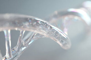 Extremely detailed translucent DNA double helix floating against a soft light background, representing advanced genetic research, human heredity studies and genome science.