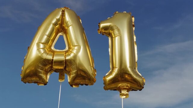 A and 1 golden letters balloons in the  sky.