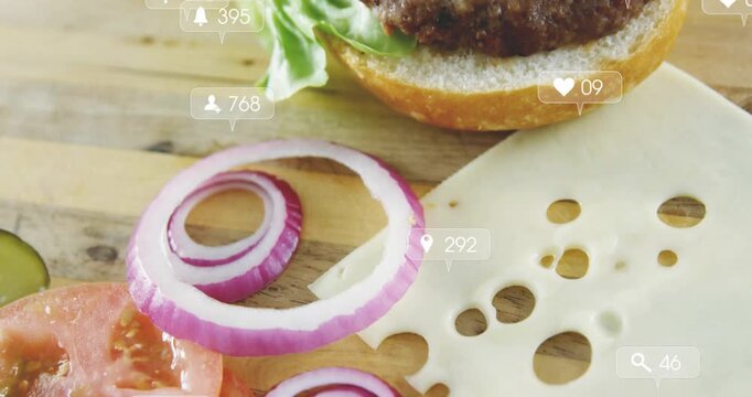 Notification icons appearing over burger assembly, drifting over onion and tomato, showing buzz